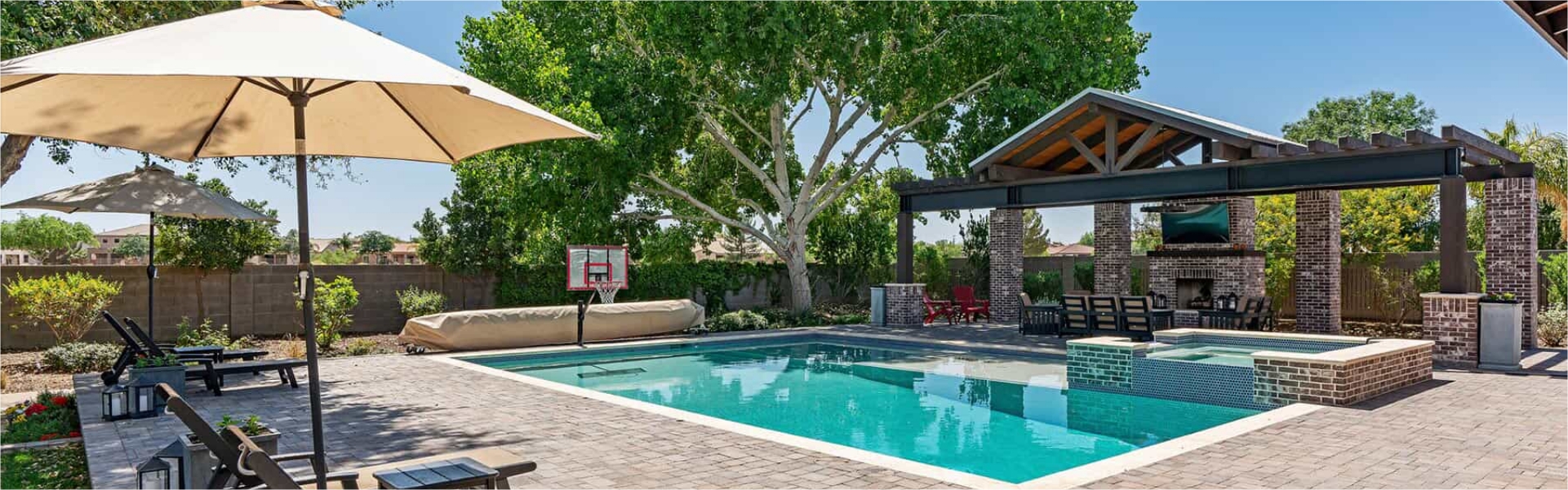 Swimming pool with patio lounge area