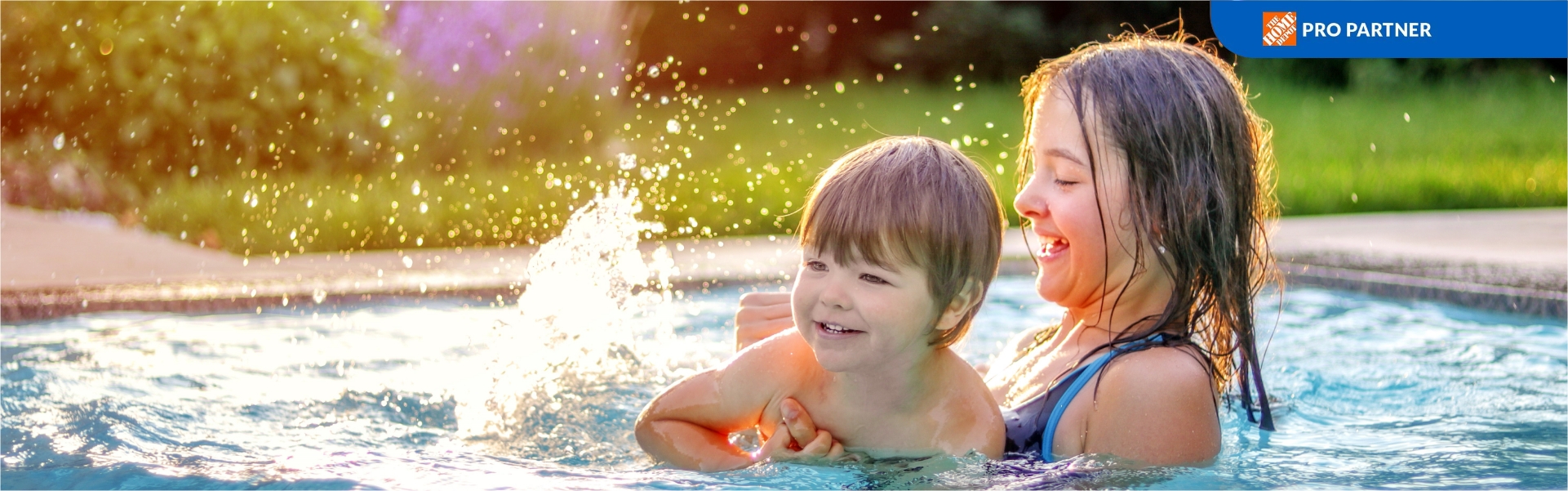 Brother and sister playing in the pool