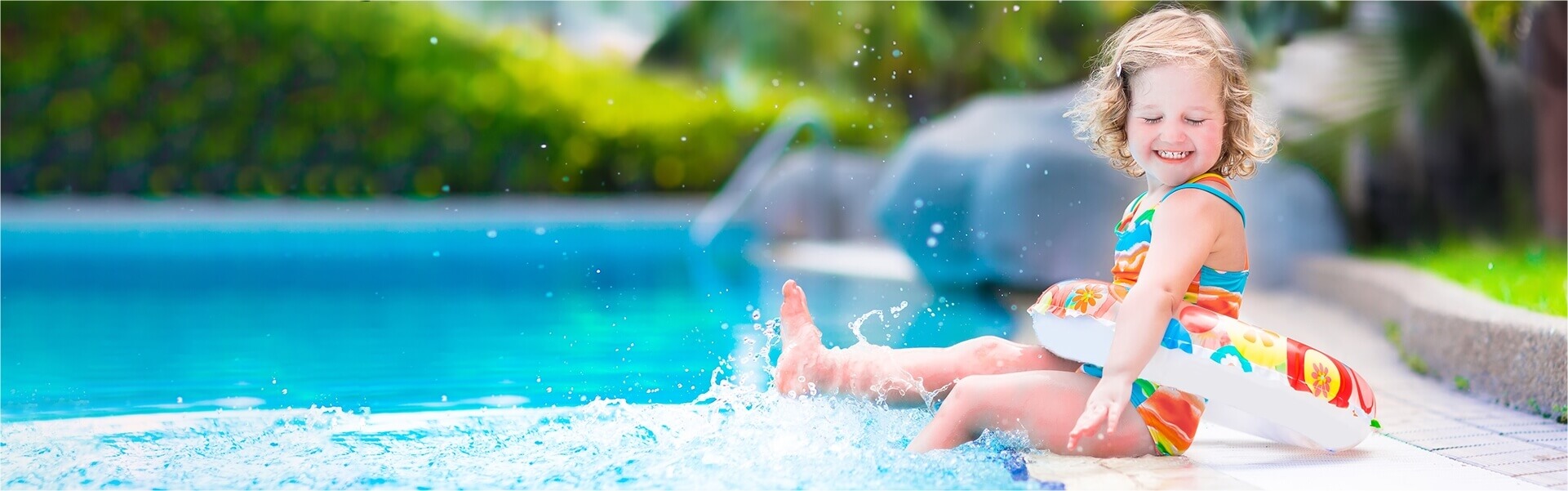 Child splashing in a pool