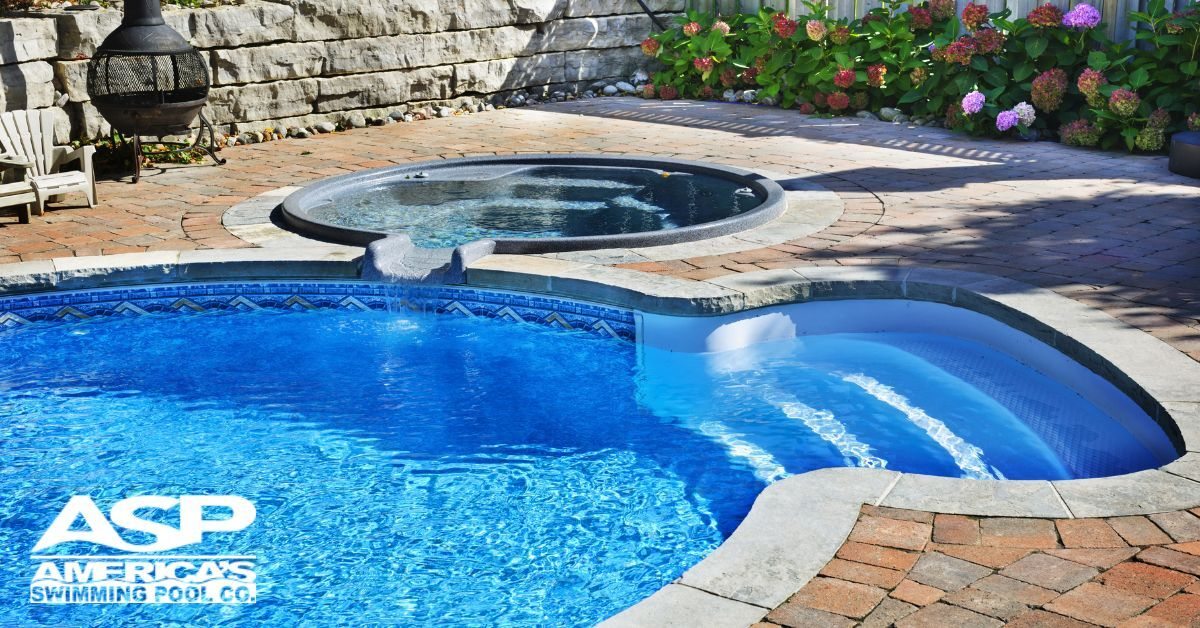 Nice pool with stairs and hot tub connected on the side