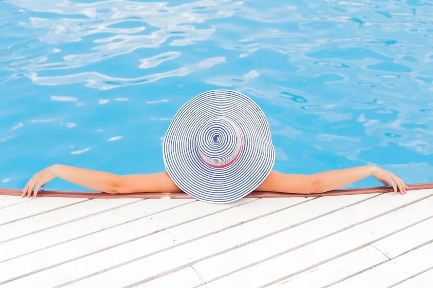 Woman laying by pool