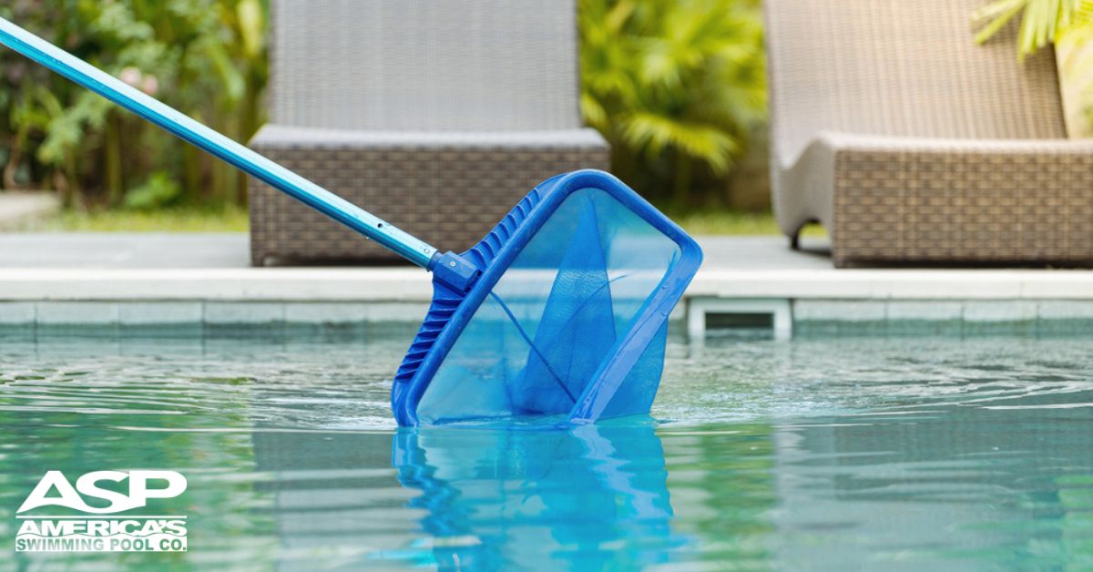 pool skimmer net removing debris from pool surface